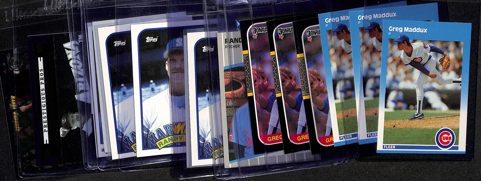 Lot of (21) Greg Maddux & Randy Johnson Mostly Rookie & Insert Cards w. (3) 1987 Fleer Update Greg Maddux Rookie, 1987 Donruss Greg Maddux Rookie, (2) 1989 Fleer Randy Johnson Rookie, +